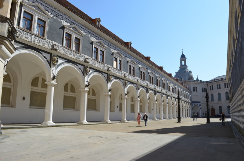 11 - The historic Stallhof (Stable Courtyard) at Dresden Castle (Residenzschloss) in Dresden, Germany, with the dome of the famous Frauenkirche visible in the background